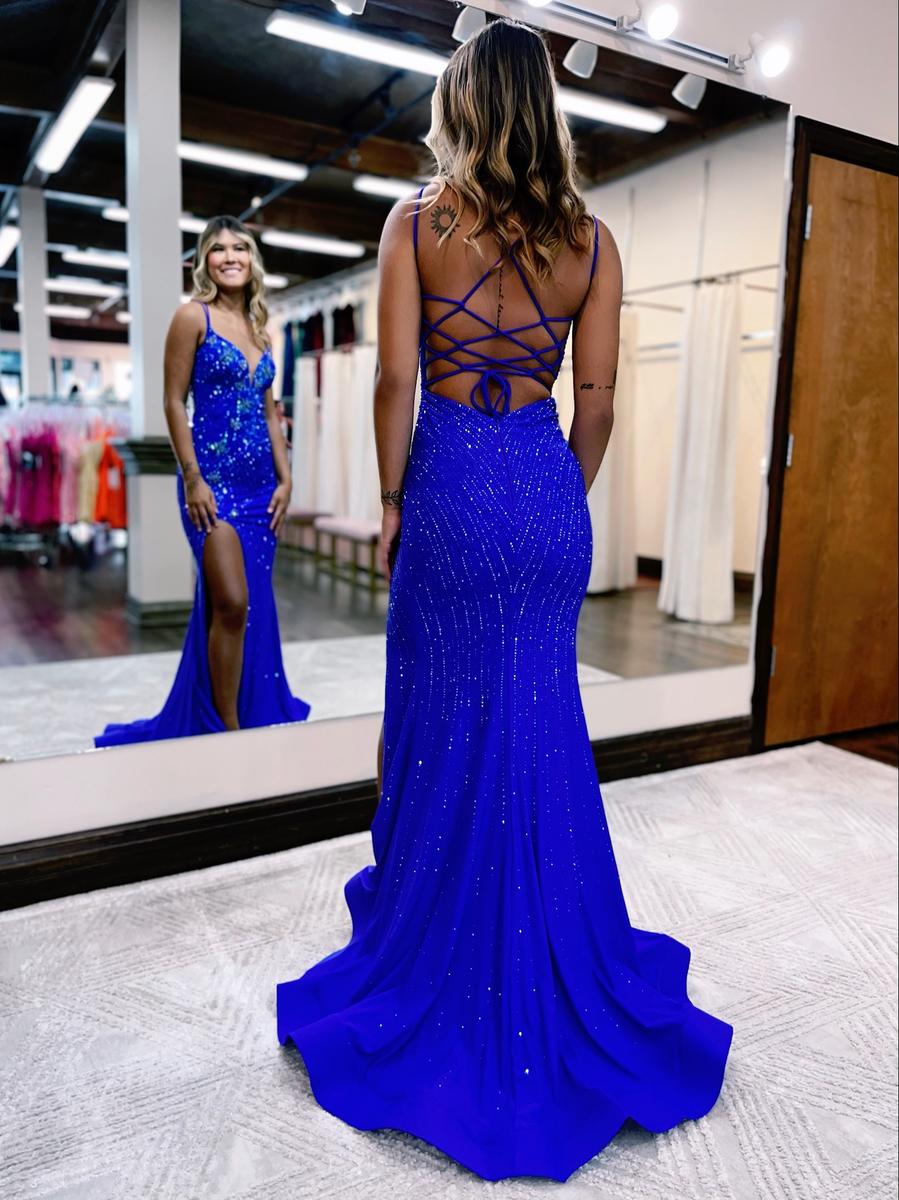 Prom dress features a beautiful crystal pattern through the bodice of the entire dress and colorfully beaded butterfly details