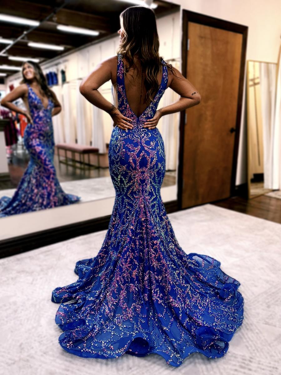 Prom dress is fully sequined in a beautiful pattern! Featuring a v-neck plunge and sheer side detailing