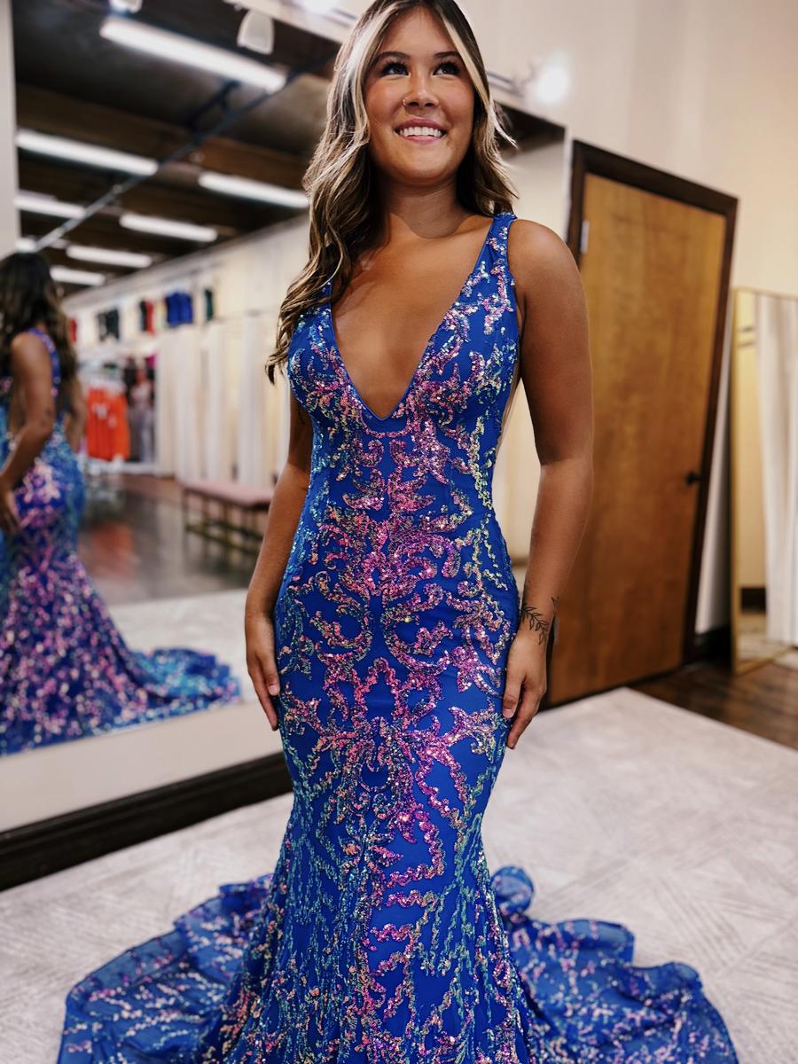 Prom dress is fully sequined in a beautiful pattern! Featuring a v-neck plunge and sheer side detailing